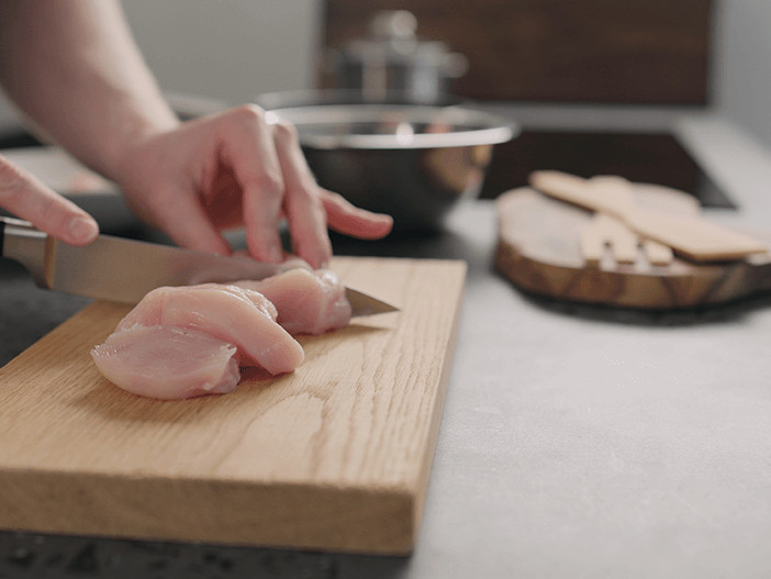 How can I avoid food poisoning when cooking at home?